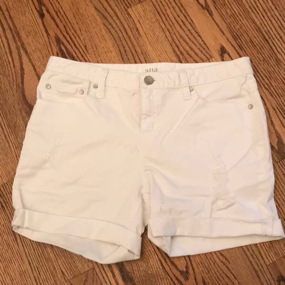 White cotton shorts with pre-made rips.